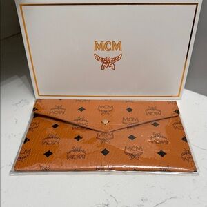 MCM cognac Logo Envelope Clutch new sealed. Wallet. New! Large size.